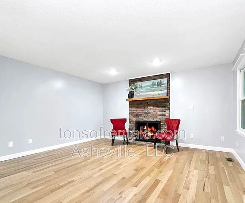 This beautiful freshly painted single-family home in Pisgah Forest, NC offers 3 bedrooms, 2.5 bathrooms, and multiple living spaces including a bonus room and a gas fireplace. property image