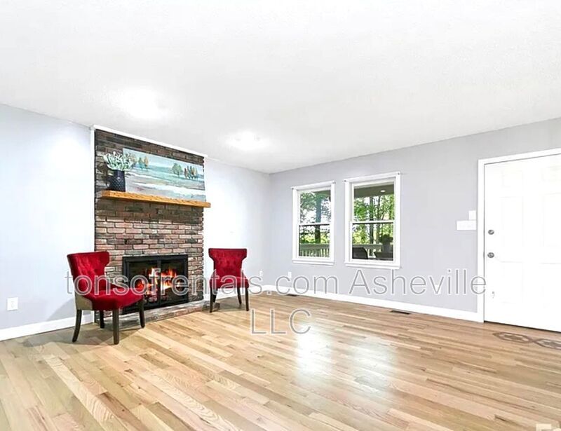 This beautiful freshly painted single-family home in Pisgah Forest, NC offers 3 bedrooms, 2.5 bathrooms, and multiple living spaces including a bonus room and a gas fireplace. property image