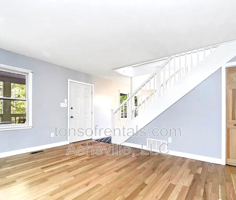 This beautiful freshly painted single-family home in Pisgah Forest, NC offers 3 bedrooms, 2.5 bathrooms, and multiple living spaces including a bonus room and a gas fireplace. property image