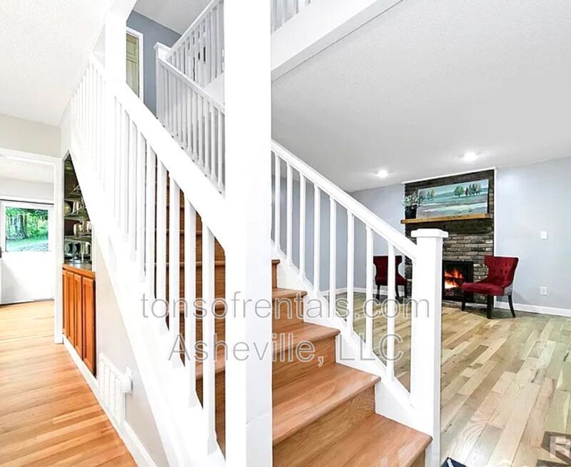 This beautiful freshly painted single-family home in Pisgah Forest, NC offers 3 bedrooms, 2.5 bathrooms, and multiple living spaces including a bonus room and a gas fireplace. property image