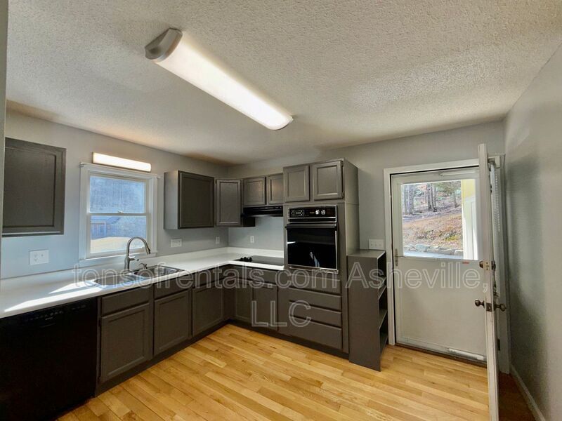 This beautiful freshly painted single-family home in Pisgah Forest, NC offers 3 bedrooms, 2.5 bathrooms, and multiple living spaces including a bonus room and a gas fireplace. property image