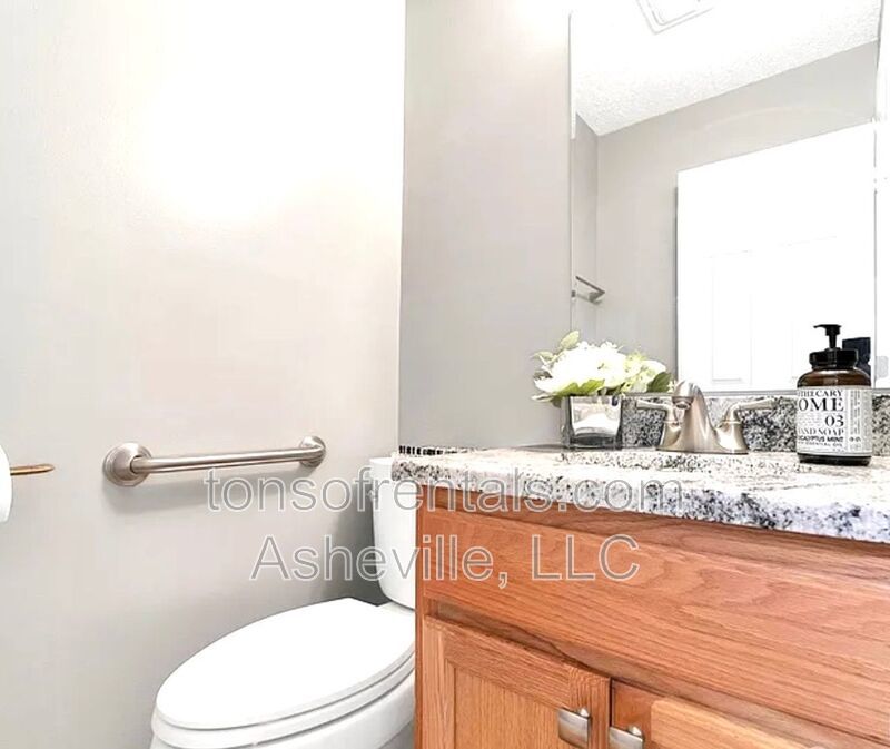 This beautiful freshly painted single-family home in Pisgah Forest, NC offers 3 bedrooms, 2.5 bathrooms, and multiple living spaces including a bonus room and a gas fireplace. property image