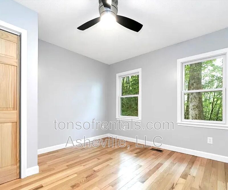 This beautiful freshly painted single-family home in Pisgah Forest, NC offers 3 bedrooms, 2.5 bathrooms, and multiple living spaces including a bonus room and a gas fireplace. property image