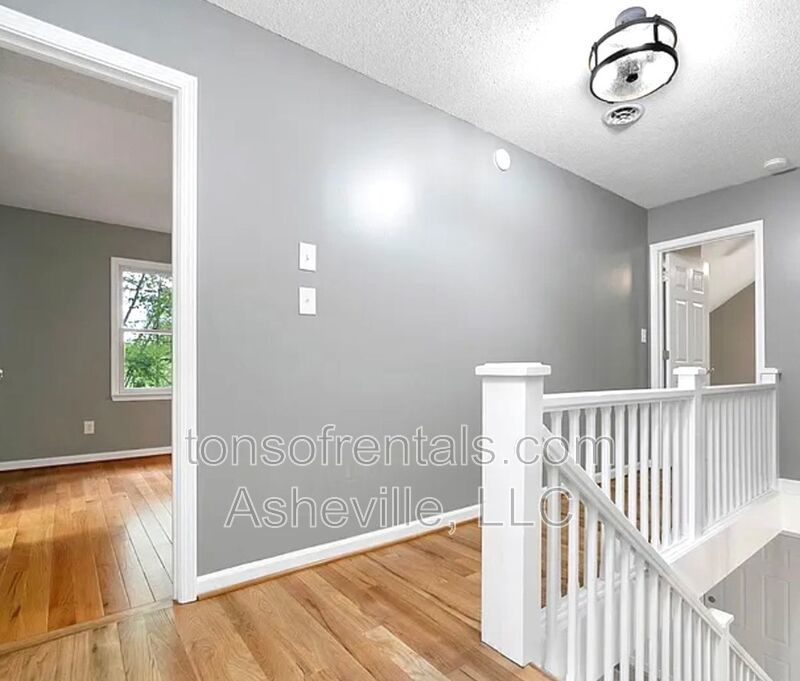 This beautiful freshly painted single-family home in Pisgah Forest, NC offers 3 bedrooms, 2.5 bathrooms, and multiple living spaces including a bonus room and a gas fireplace. property image