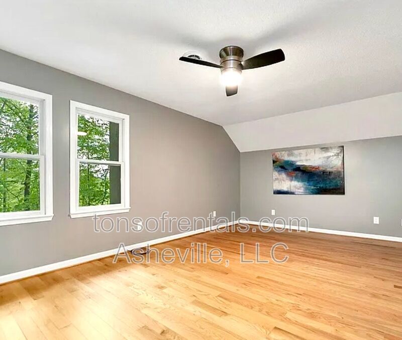 This beautiful freshly painted single-family home in Pisgah Forest, NC offers 3 bedrooms, 2.5 bathrooms, and multiple living spaces including a bonus room and a gas fireplace. property image