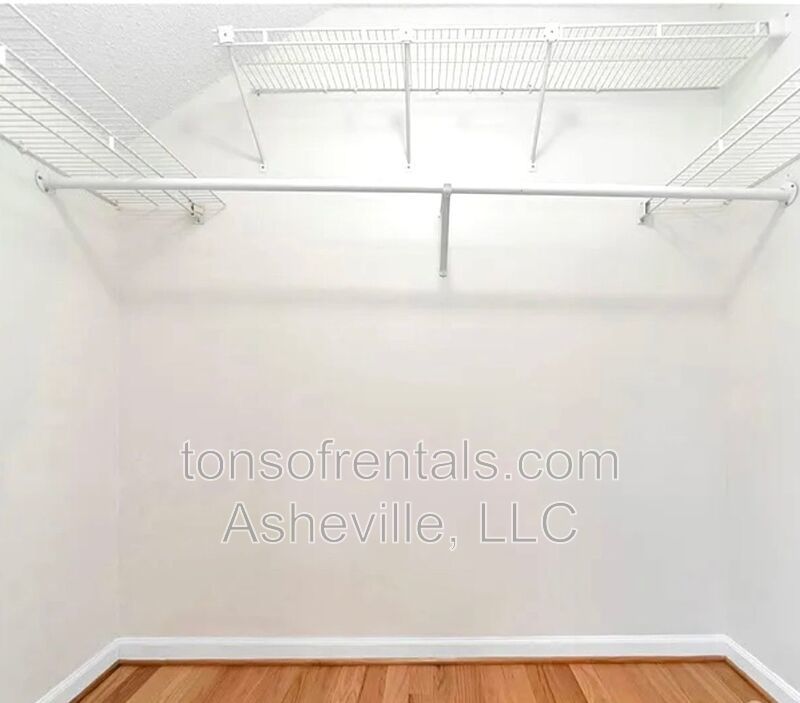 This beautiful freshly painted single-family home in Pisgah Forest, NC offers 3 bedrooms, 2.5 bathrooms, and multiple living spaces including a bonus room and a gas fireplace. property image