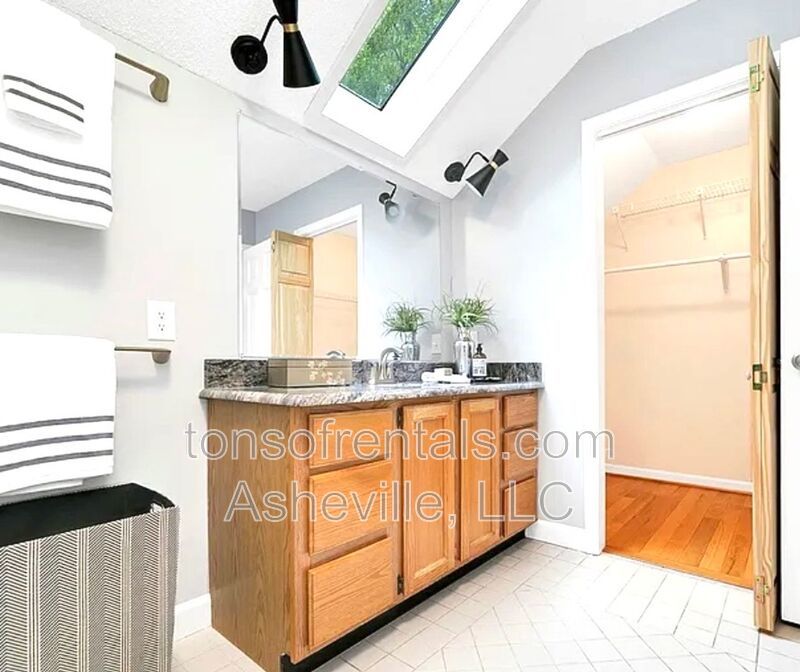 This beautiful freshly painted single-family home in Pisgah Forest, NC offers 3 bedrooms, 2.5 bathrooms, and multiple living spaces including a bonus room and a gas fireplace. property image