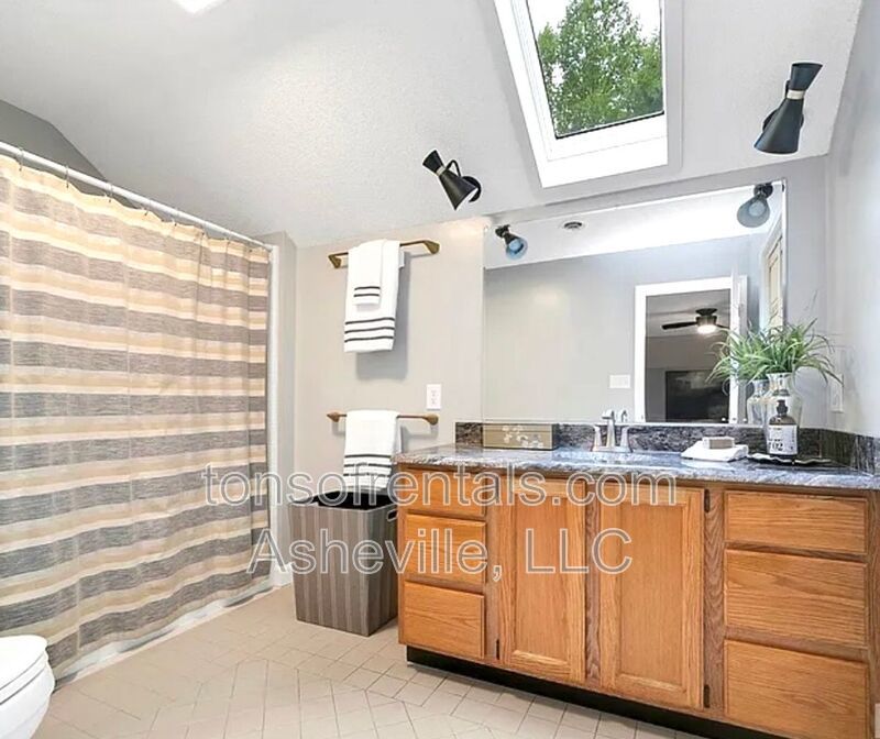 This beautiful freshly painted single-family home in Pisgah Forest, NC offers 3 bedrooms, 2.5 bathrooms, and multiple living spaces including a bonus room and a gas fireplace. property image