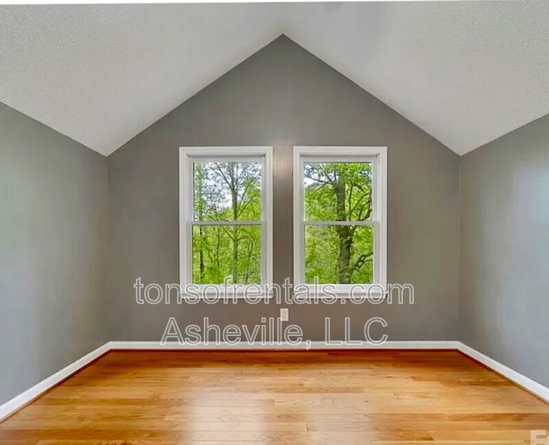 This beautiful freshly painted single-family home in Pisgah Forest, NC offers 3 bedrooms, 2.5 bathrooms, and multiple living spaces including a bonus room and a gas fireplace. property image