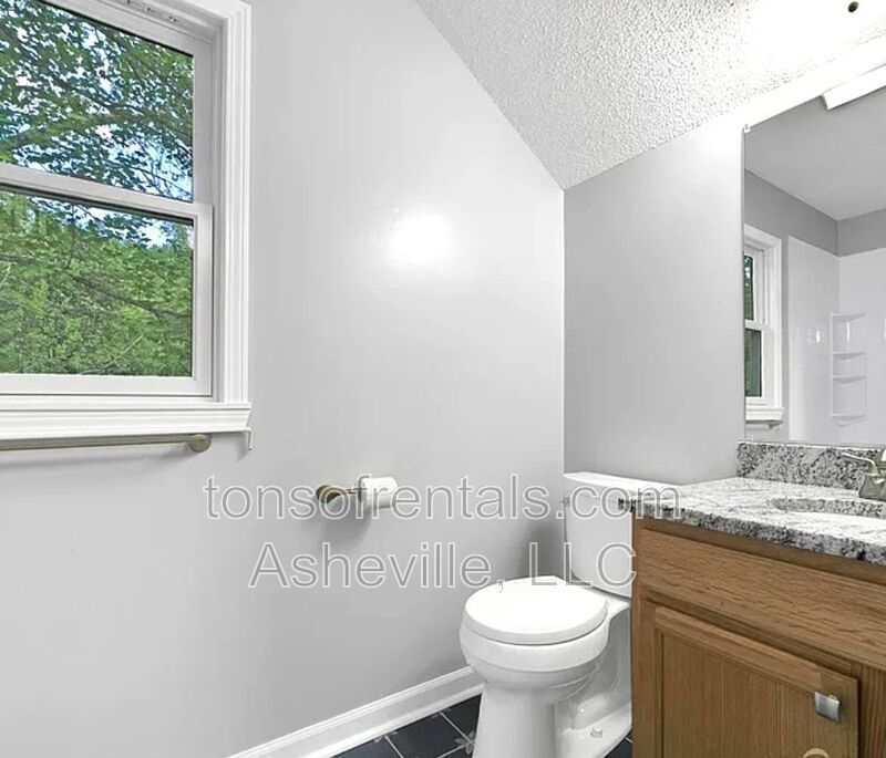 This beautiful freshly painted single-family home in Pisgah Forest, NC offers 3 bedrooms, 2.5 bathrooms, and multiple living spaces including a bonus room and a gas fireplace. property image