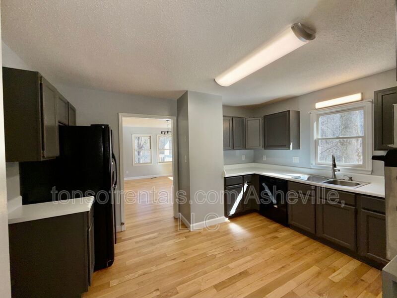 This beautiful freshly painted single-family home in Pisgah Forest, NC offers 3 bedrooms, 2.5 bathrooms, and multiple living spaces including a bonus room and a gas fireplace. property image