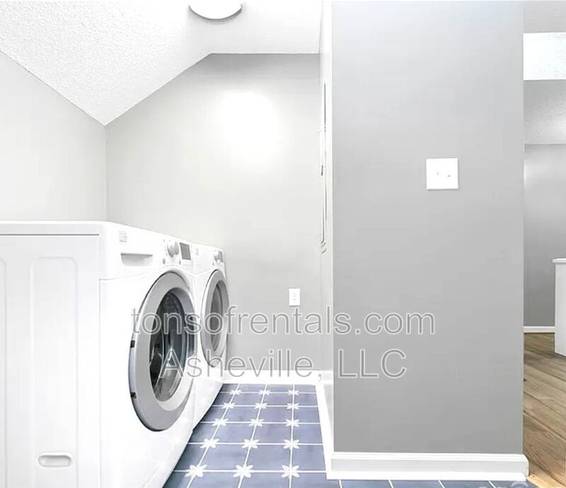 This beautiful freshly painted single-family home in Pisgah Forest, NC offers 3 bedrooms, 2.5 bathrooms, and multiple living spaces including a bonus room and a gas fireplace. property image