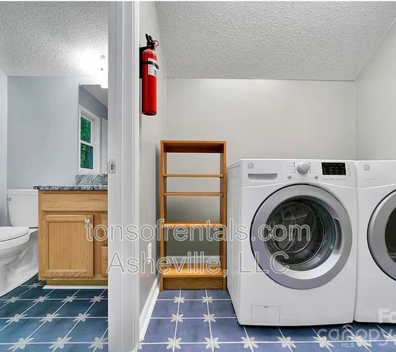 This beautiful freshly painted single-family home in Pisgah Forest, NC offers 3 bedrooms, 2.5 bathrooms, and multiple living spaces including a bonus room and a gas fireplace. property image