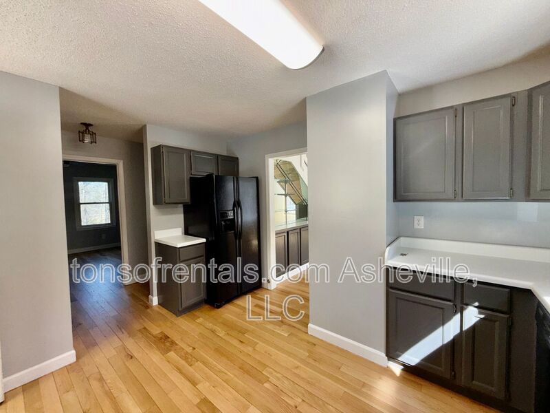 This beautiful freshly painted single-family home in Pisgah Forest, NC offers 3 bedrooms, 2.5 bathrooms, and multiple living spaces including a bonus room and a gas fireplace. property image