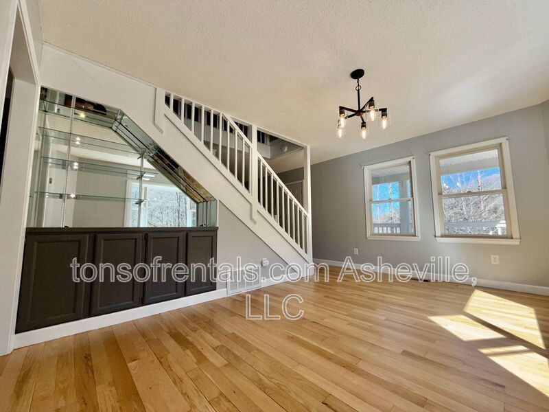 This beautiful freshly painted single-family home in Pisgah Forest, NC offers 3 bedrooms, 2.5 bathrooms, and multiple living spaces including a bonus room and a gas fireplace. property image
