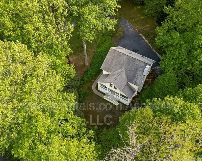 This beautiful freshly painted single-family home in Pisgah Forest, NC offers 3 bedrooms, 2.5 bathrooms, and multiple living spaces including a bonus room and a gas fireplace. property image