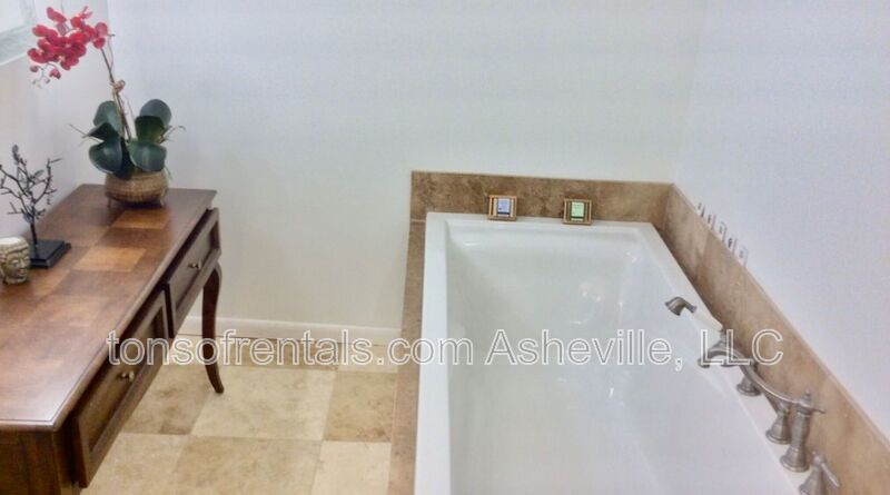 Welcome to your dream home in Arden, NC. This stunning 5-bedroom, 3.5-bathroom house is nestled on a 20-acre lot at the end of a cul-de-sac, offering breathtaking lake views. property image