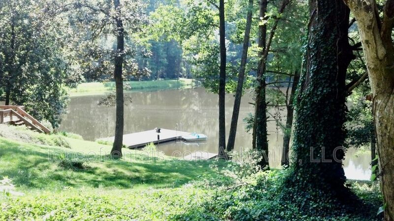 Welcome to your dream home in Arden, NC. This stunning 5-bedroom, 3.5-bathroom house is nestled on a 20-acre lot at the end of a cul-de-sac, offering breathtaking lake views. property image