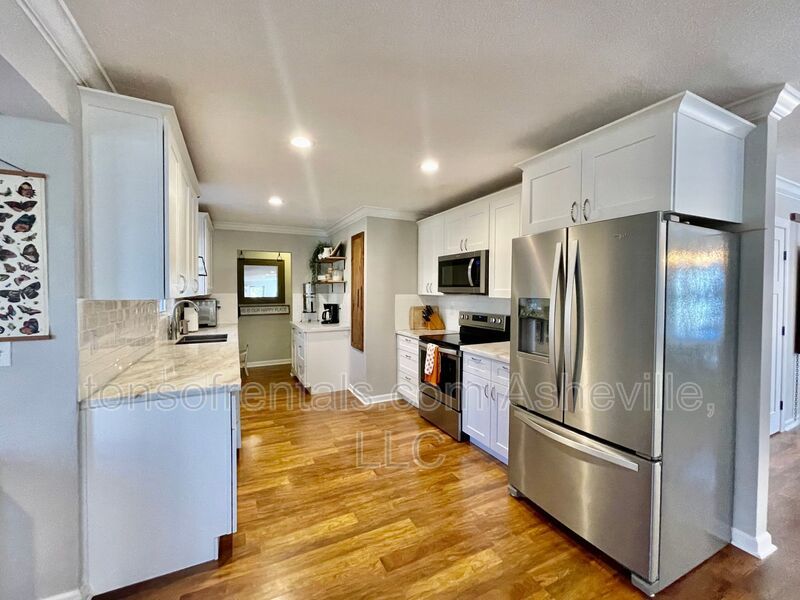 This stunning home is located in Arden, a mile from Glen Bridge River Park, perfect for kayaking & fishing on the French Broad River. property image