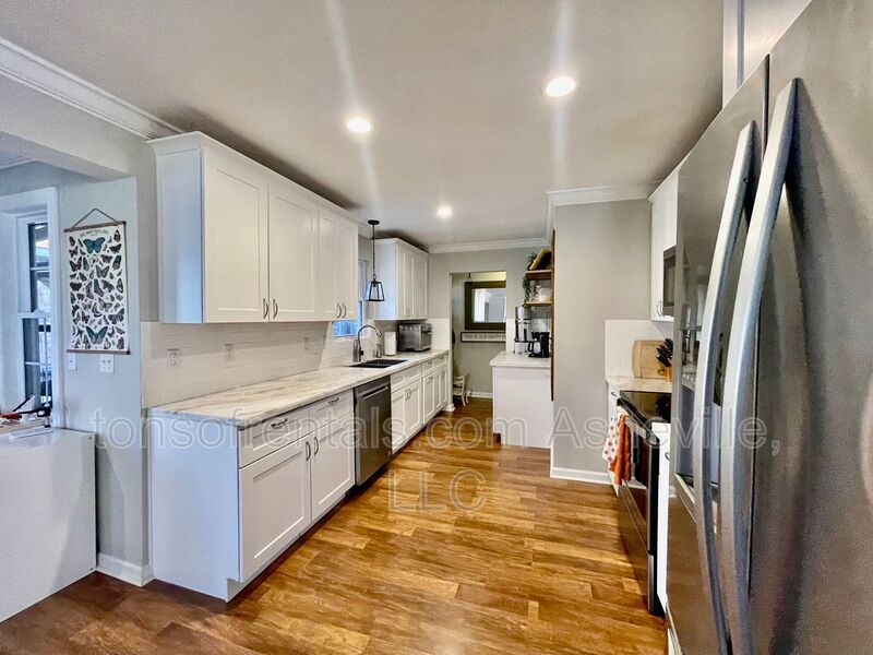 This stunning home is located in Arden, a mile from Glen Bridge River Park, perfect for kayaking & fishing on the French Broad River. property image