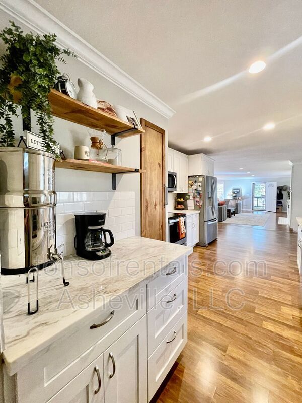 This stunning home is located in Arden, a mile from Glen Bridge River Park, perfect for kayaking & fishing on the French Broad River. property image