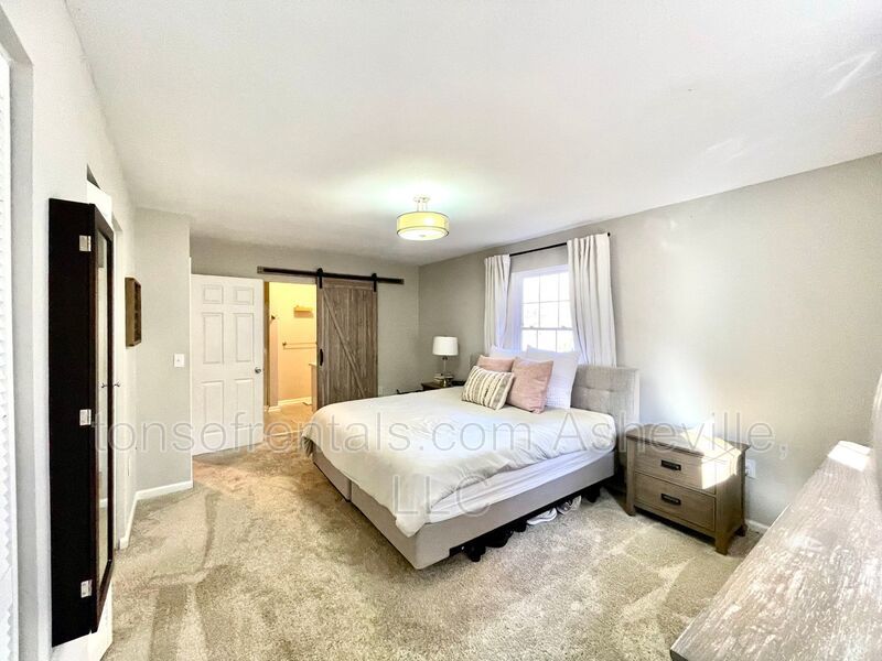 This stunning home is located in Arden, a mile from Glen Bridge River Park, perfect for kayaking & fishing on the French Broad River. property image