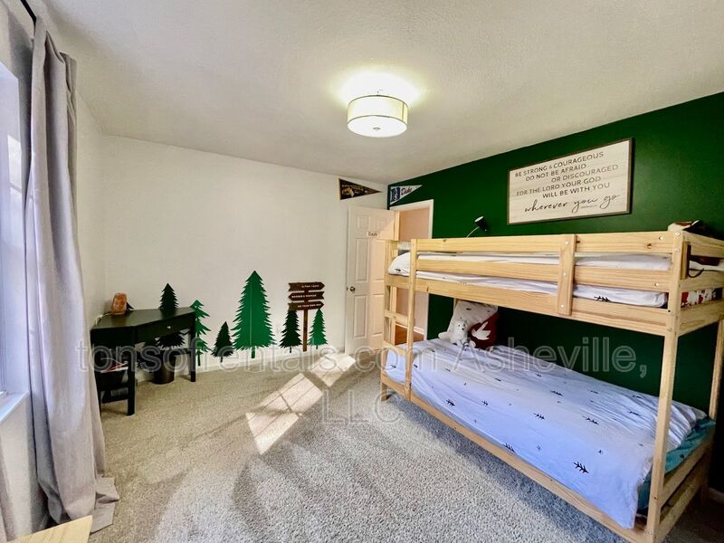 This stunning home is located in Arden, a mile from Glen Bridge River Park, perfect for kayaking & fishing on the French Broad River. property image