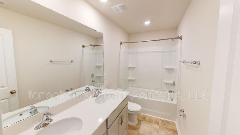 Welcome to this beautiful 4-bedroom, 2.5-bath home located in the charming town of Candler. property image