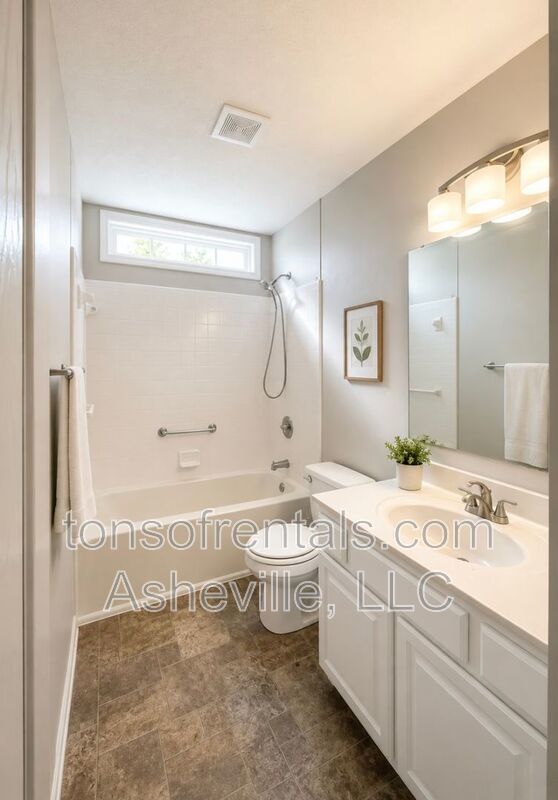 Welcome to this charming single-family home located in the beautiful town of Fletcher, NC. property image