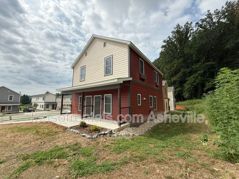 Freshly built upstairs duplex unit in Brevard, NC, offering a bright one-bedroom, one-bath layout with an open floor plan and vinyl flooring throughout. property image